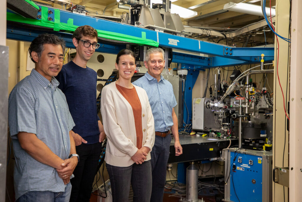 Photo showing Anthony Rozales, Joshua Woods, Jen Wacker, and Marc Allaire at beamline 5.0.2 in the Advanced Light Source.