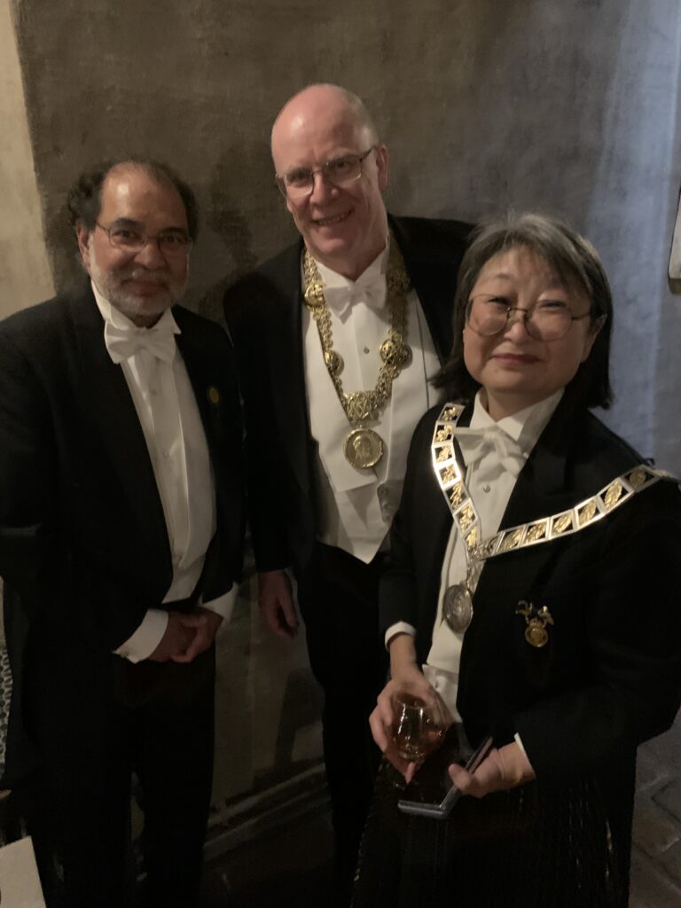 Three people in formal dress